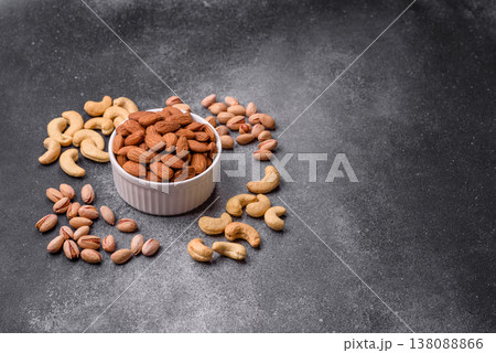 Raw and peeled almonds as a healthy food ingredient. Almonds as a food background Raw and peeled almonds as a healthy food ingredient. Almonds as a food background 138088866