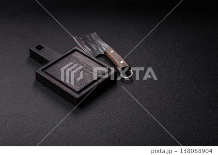An empty wooden cutting board with cutlery on a kitchen counter. A wooden cutting board An empty wooden cutting board with cutlery on a kitchen counter. A wooden cutting board 138088904