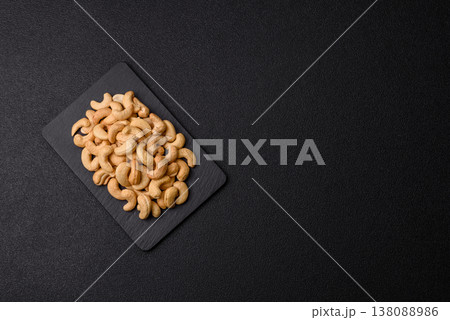 Roasted or raw cashew make a savory snack for a healthy, filling meal. Cashew nuts Roasted or raw cashew make a savory snack for a healthy, filling meal. Cashew nuts 138088986