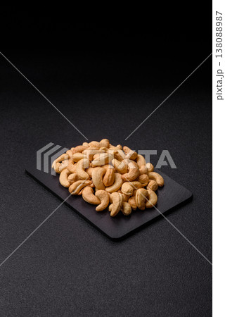 Roasted or raw cashew make a savory snack for a healthy, filling meal. Cashew nuts Roasted or raw cashew make a savory snack for a healthy, filling meal. Cashew nuts 138088987