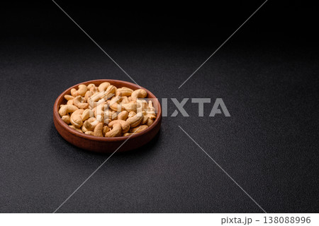 Roasted or raw cashew make a savory snack for a healthy, filling meal. Cashew nuts Roasted or raw cashew make a savory snack for a healthy, filling meal. Cashew nuts 138088996