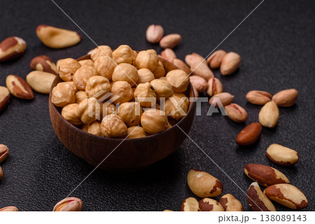 Whole peeled hazelnuts, roasted or raw, as an ingredient for healthy food. Hazelnuts as a background Whole peeled hazelnuts, roasted or raw, as an ingredient for healthy food. Hazelnuts as a background 138089143