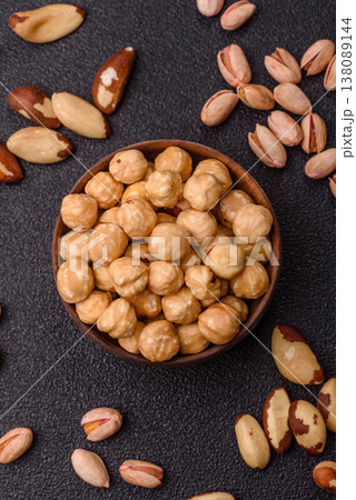 Whole peeled hazelnuts, roasted or raw, as an ingredient for healthy food. Hazelnuts as a background Whole peeled hazelnuts, roasted or raw, as an ingredient for healthy food. Hazelnuts as a background 138089144