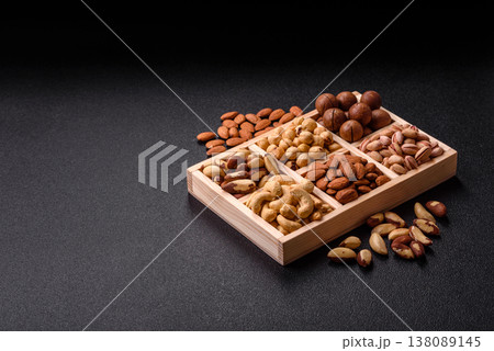 A mix of cashews, pistachios, almonds, macadamia and hazelnuts. Nuts as a food background A mix of cashews, pistachios, almonds, macadamia and hazelnuts. Nuts as a food background 138089145