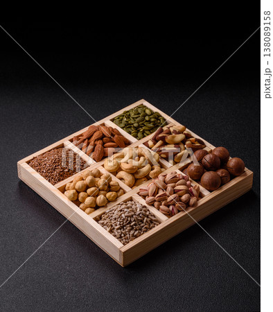 A mix of cashews, pistachios, almonds, macadamia and hazelnuts. Nuts as a food background A mix of cashews, pistachios, almonds, macadamia and hazelnuts. Nuts as a food background 138089158