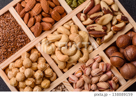 A mix of cashews, pistachios, almonds, macadamia and hazelnuts. Nuts as a food background A mix of cashews, pistachios, almonds, macadamia and hazelnuts. Nuts as a food background 138089159