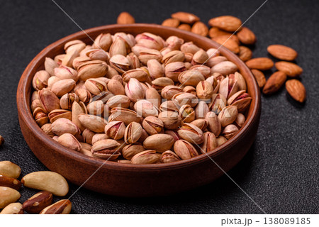 Salted pistachio nuts in shells as a healthy, high calorie food ingredient. Pistachio nuts Salted pistachio nuts in shells as a healthy, high calorie food ingredient. Pistachio nuts 138089185