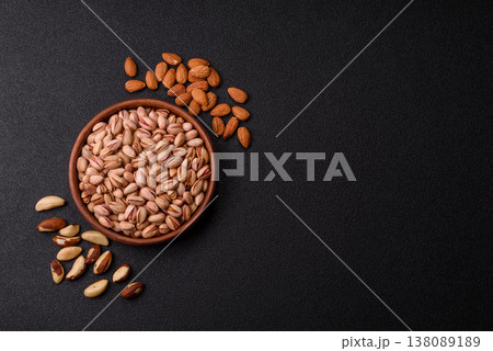 Salted pistachio nuts in shells as a healthy, high calorie food ingredient. Pistachio nuts 138089189