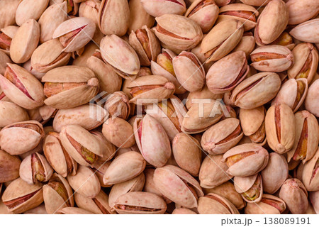 Salted pistachio nuts in shells as a healthy, high calorie food ingredient. Pistachio nuts Salted pistachio nuts in shells as a healthy, high calorie food ingredient. Pistachio nuts 138089191