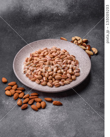 Salted pistachio nuts in shells as a healthy, high calorie food ingredient. Pistachio nuts Salted pistachio nuts in shells as a healthy, high calorie food ingredient. Pistachio nuts 138089203