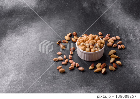 Whole peeled hazelnuts, roasted or raw, as an ingredient for healthy food. Hazelnuts as a background Whole peeled hazelnuts, roasted or raw, as an ingredient for healthy food. Hazelnuts as a background 138089257
