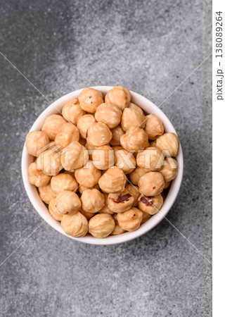 Whole peeled hazelnuts, roasted or raw, as an ingredient for healthy food. Hazelnuts as a background Whole peeled hazelnuts, roasted or raw, as an ingredient for healthy food. Hazelnuts as a background 138089264