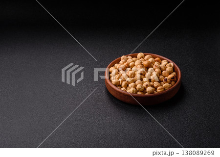 Whole peeled hazelnuts, roasted or raw, as an ingredient for healthy food. Hazelnuts as a background 138089269