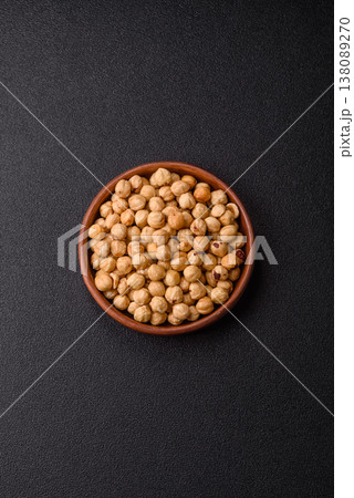 Whole peeled hazelnuts, roasted or raw, as an ingredient for healthy food. Hazelnuts as a background 138089270