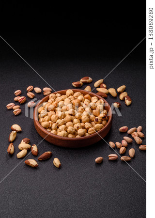 Whole peeled hazelnuts, roasted or raw, as an ingredient for healthy food. Hazelnuts as a background 138089280
