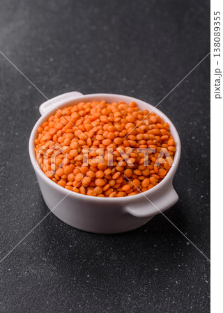 Raw red lentils as a source of protein for a healthy vegan meal. Red lentils Raw red lentils as a source of protein for a healthy vegan meal. Red lentils 138089355