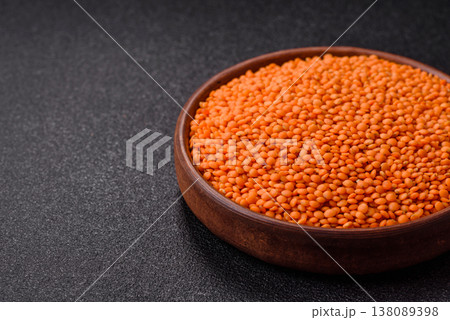 Raw red lentils as a source of protein for a healthy vegan meal. Red lentils Raw red lentils as a source of protein for a healthy vegan meal. Red lentils 138089398