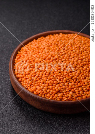 Raw red lentils as a source of protein for a healthy vegan meal. Red lentils Raw red lentils as a source of protein for a healthy vegan meal. Red lentils 138089402
