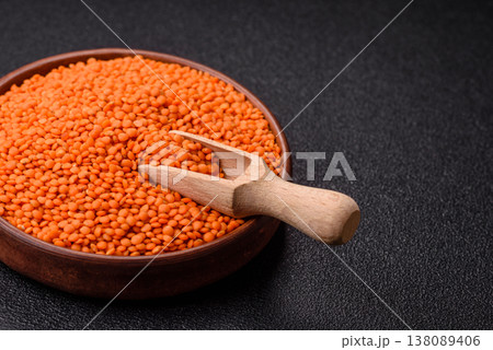 Raw red lentils as a source of protein for a healthy vegan meal. Red lentils Raw red lentils as a source of protein for a healthy vegan meal. Red lentils 138089406