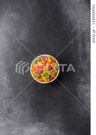 Candied fruit in colorful cubes as an ingredient for baked goods and sweets. Candied fruit 138089492