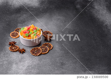 Candied fruit in colorful cubes as an ingredient for baked goods and sweets. Candied fruit Candied fruit in colorful cubes as an ingredient for baked goods and sweets. Candied fruit 138089500