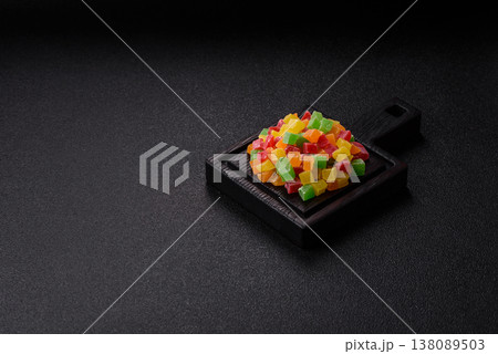 Candied fruit in colorful cubes as an ingredient for baked goods and sweets. Candied fruit 138089503