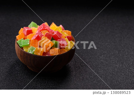 Candied fruit in colorful cubes as an ingredient for baked goods and sweets. Candied fruit Candied fruit in colorful cubes as an ingredient for baked goods and sweets. Candied fruit 138089523