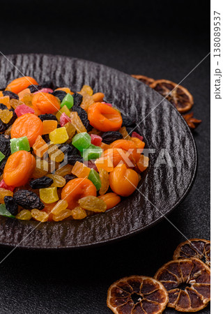 Dried apricots, raisins, and candied fruits as ingredients for baked goods and sweets. Dried fruits Dried apricots, raisins, and candied fruits as ingredients for baked goods and sweets. Dried fruits 138089537