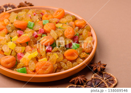 Dried apricots, raisins, and candied fruits as ingredients for baked goods and sweets. Dried fruits Dried apricots, raisins, and candied fruits as ingredients for baked goods and sweets. Dried fruits 138089546