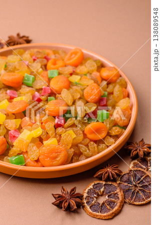 Dried apricots, raisins, and candied fruits as ingredients for baked goods and sweets. Dried fruits Dried apricots, raisins, and candied fruits as ingredients for baked goods and sweets. Dried fruits 138089548