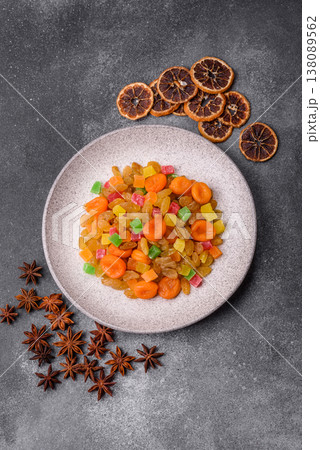 Dried apricots, raisins, and candied fruits as ingredients for baked goods and sweets. Dried fruits Dried apricots, raisins, and candied fruits as ingredients for baked goods and sweets. Dried fruits 138089562