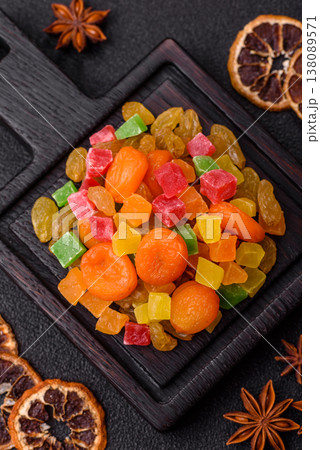 Dried apricots, raisins, and candied fruits as ingredients for baked goods and sweets. Dried fruits Dried apricots, raisins, and candied fruits as ingredients for baked goods and sweets. Dried fruits 138089571