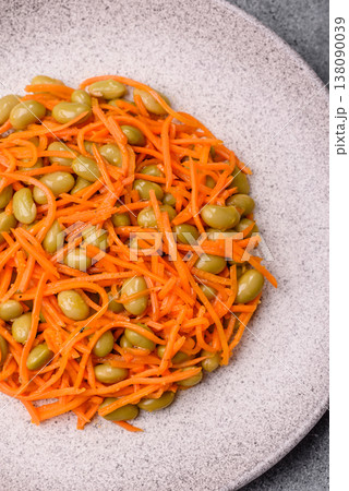 Asian salad with edamame beans, carrots, tofu, and spices. Edamame and carrot salad Asian salad with edamame beans, carrots, tofu, and spices. Edamame and carrot salad 138090039
