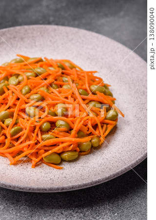Asian salad with edamame beans, carrots, tofu, and spices. Edamame and carrot salad Asian salad with edamame beans, carrots, tofu, and spices. Edamame and carrot salad 138090040