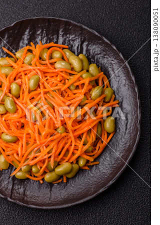 Asian salad with edamame beans, carrots, tofu, and spices. Edamame and carrot salad 138090051