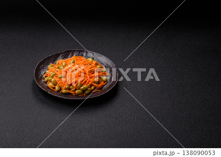 Asian salad with edamame beans, carrots, tofu, and spices. Edamame and carrot salad 138090053