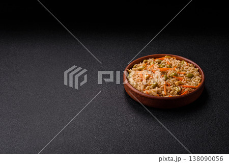 Asian food with rice, edamame, carrots, tofu, and spices. Rice with edamame and carrots 138090056