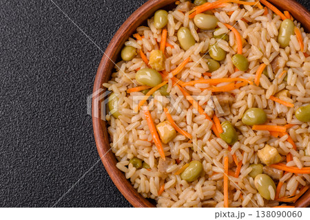 Asian food with rice, edamame, carrots, tofu, and spices. Rice with edamame and carrots Asian food with rice, edamame, carrots, tofu, and spices. Rice with edamame and carrots 138090060