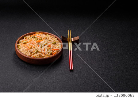 Asian food with rice, edamame, carrots, tofu, and spices. Rice with edamame and carrots Asian food with rice, edamame, carrots, tofu, and spices. Rice with edamame and carrots 138090065