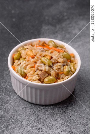 Asian food with rice, edamame, carrots, tofu, and spices. Rice with edamame and carrots Asian food with rice, edamame, carrots, tofu, and spices. Rice with edamame and carrots 138090076