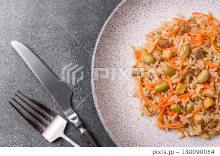 Asian food with rice, edamame, carrots, tofu, and spices. Rice with edamame and carrots Asian food with rice, edamame, carrots, tofu, and spices. Rice with edamame and carrots 138090084