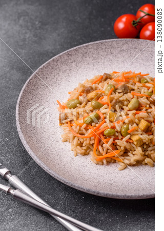 Asian food with rice, edamame, carrots, tofu, and spices. Rice with edamame and carrots 138090085