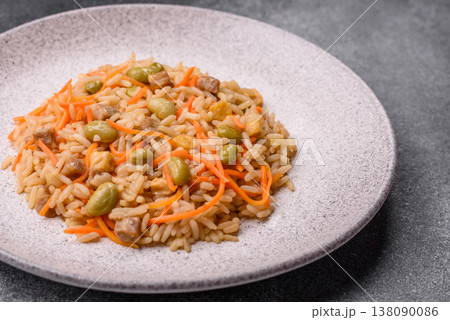 Asian food with rice, edamame, carrots, tofu, and spices. Rice with edamame and carrots Asian food with rice, edamame, carrots, tofu, and spices. Rice with edamame and carrots 138090086