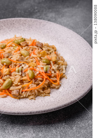 Asian food with rice, edamame, carrots, tofu, and spices. Rice with edamame and carrots Asian food with rice, edamame, carrots, tofu, and spices. Rice with edamame and carrots 138090088