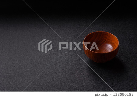 An empty round brown wooden bowl for Asian food. An empty wooden bowl An empty round brown wooden bowl for Asian food. An empty wooden bowl 138090185