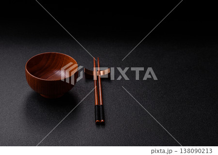 An empty round brown wooden bowl for Asian food. An empty wooden bowl An empty round brown wooden bowl for Asian food. An empty wooden bowl 138090213