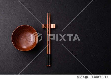 An empty round brown wooden bowl for Asian food. An empty wooden bowl 138090214