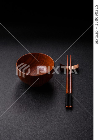 An empty round brown wooden bowl for Asian food. An empty wooden bowl An empty round brown wooden bowl for Asian food. An empty wooden bowl 138090215