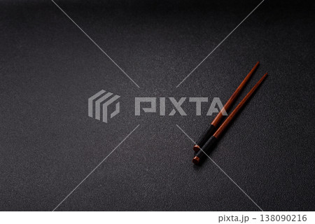 Wooden bamboo chopsticks for sushi and other Asian food with a blank background. Wooden chopsticks 138090216