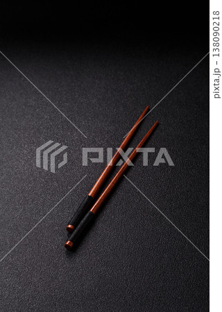 Wooden bamboo chopsticks for sushi and other Asian food with a blank background. Wooden chopsticks 138090218